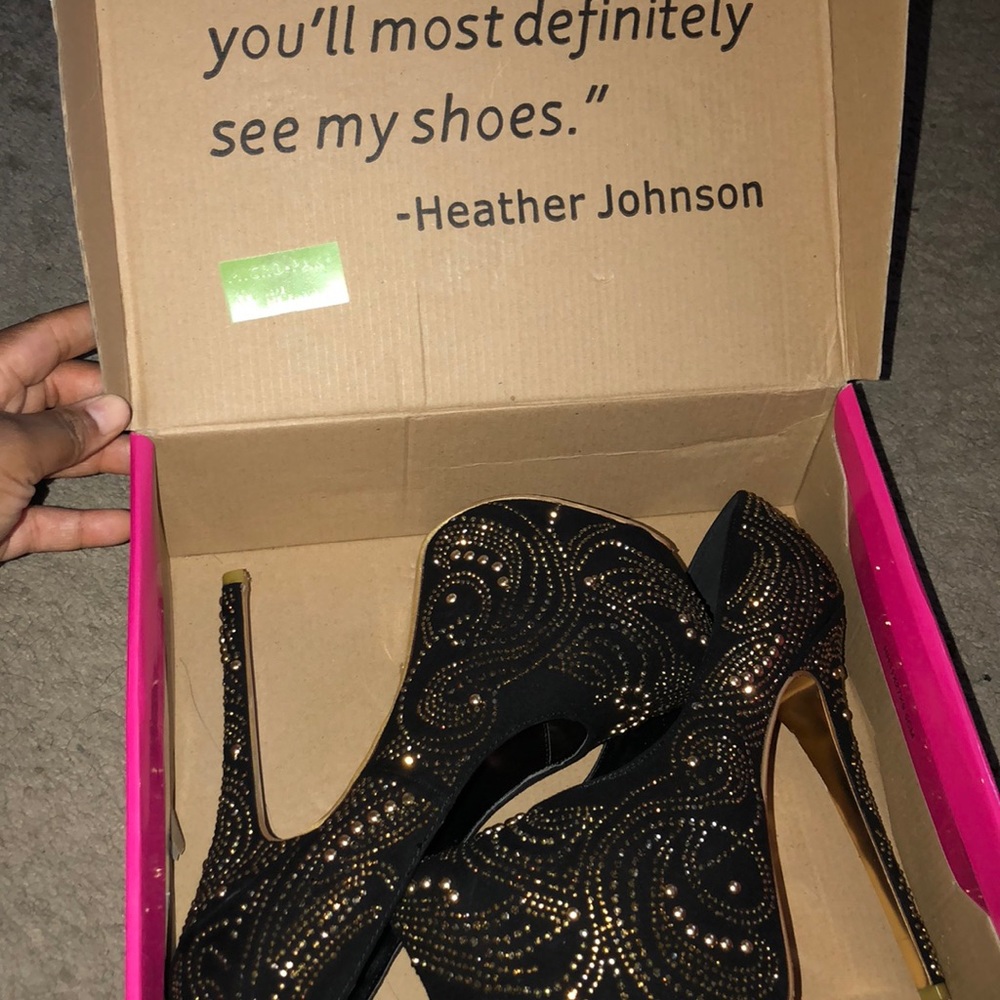 Gold and black pumps with gold rim stones